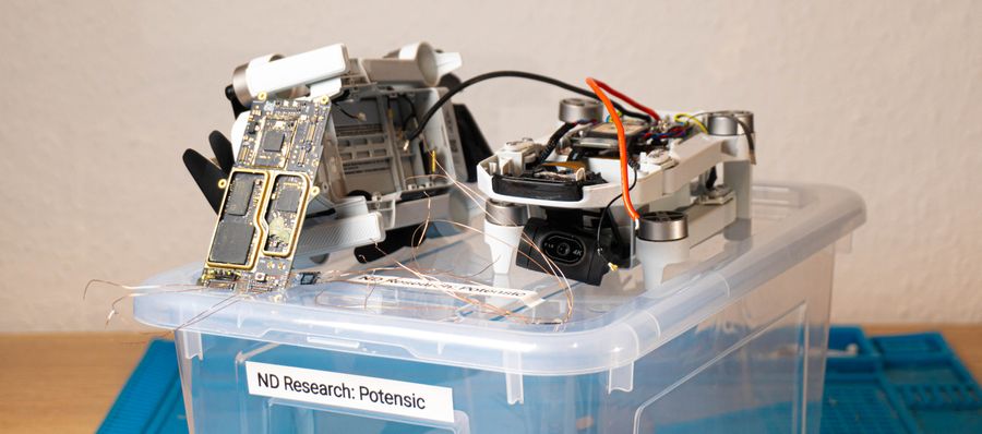 Desoldering a drone's flash chip and reconstructing the firmware from broken data.
