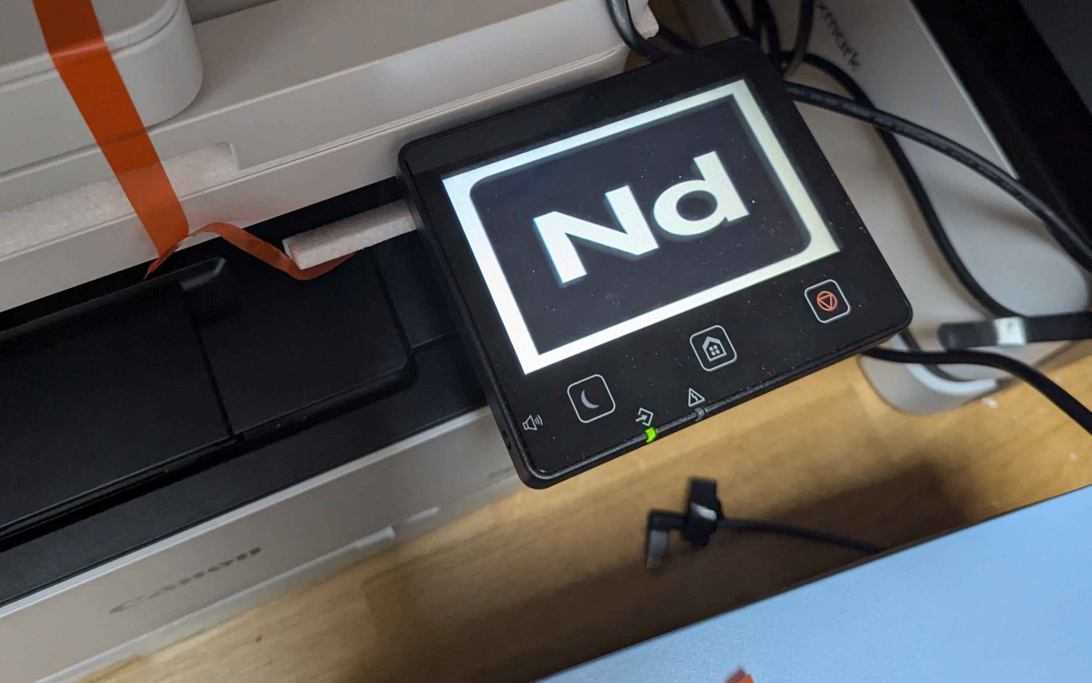 The Canon printer with our logo after the exploit